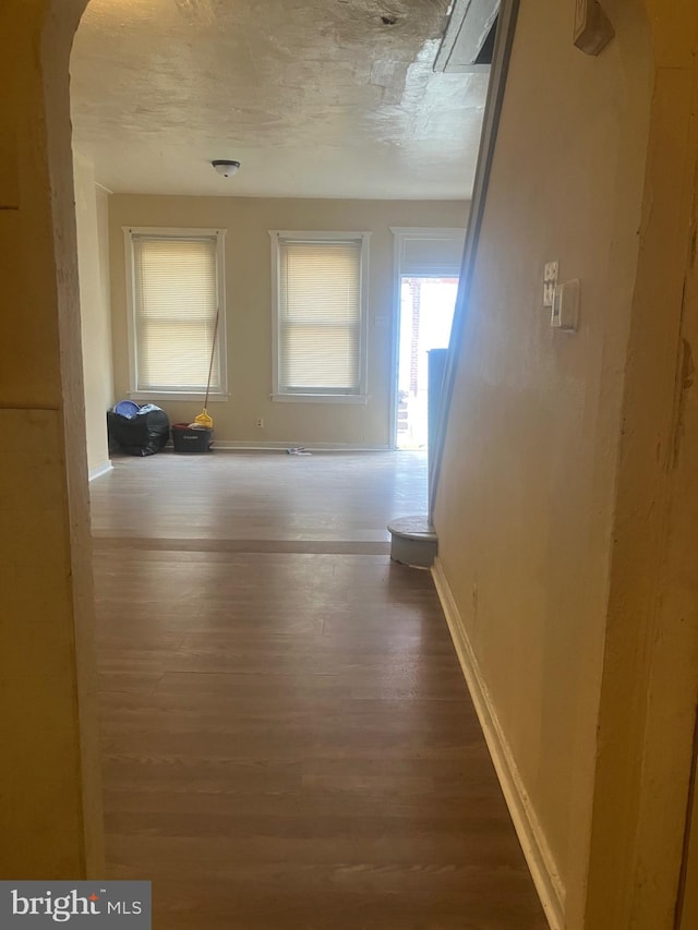 corridor featuring hardwood / wood-style floors