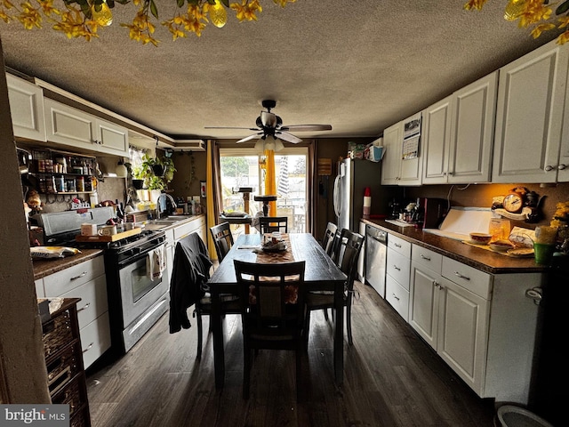255 Regina Ave, Hamilton, NJ 08619 - kitchen with appliances with stainless steel finishes, dark countertops, white cabinets, and a textured ceiling