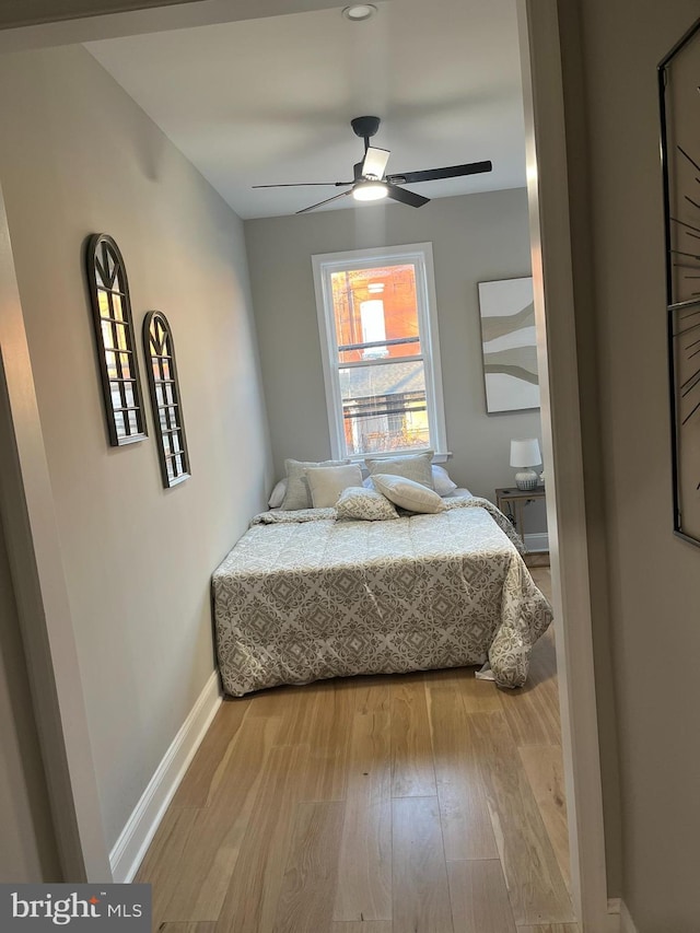 bedroom featuring ceiling fan and hardwood / wood-style flooring