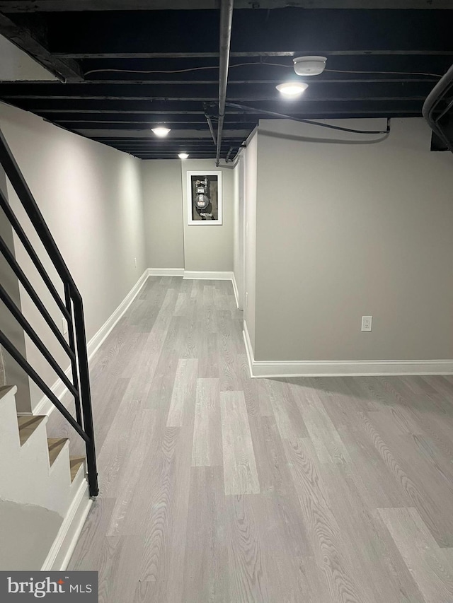 basement featuring light hardwood / wood-style floors