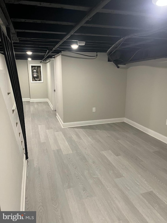 basement featuring light wood-type flooring