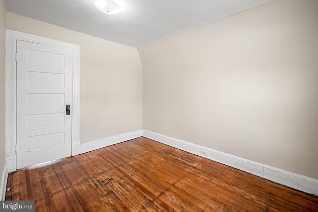 unfurnished room featuring hardwood / wood-style flooring