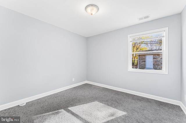 unfurnished room featuring carpet