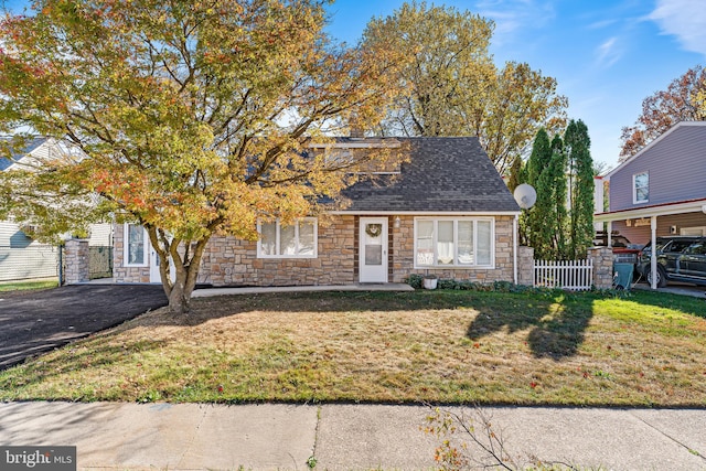 view of front of home with a front yard