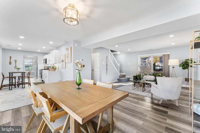 dining area with light hardwood / wood-style floors