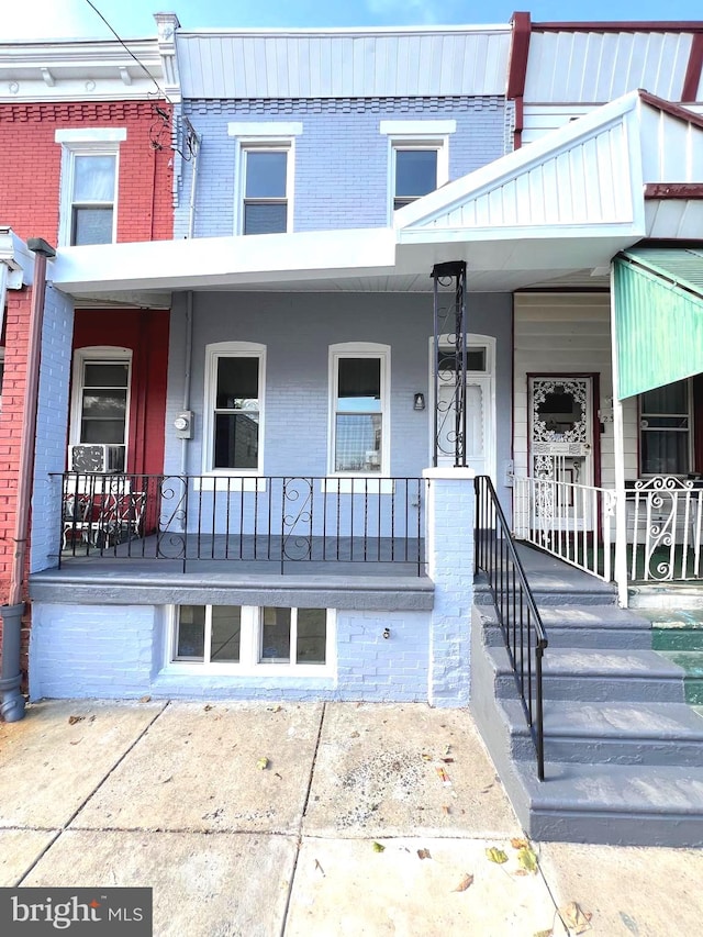 view of property with a porch