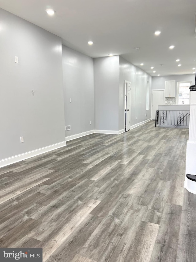 unfurnished living room featuring hardwood / wood-style floors