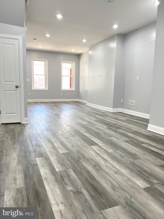 unfurnished room featuring dark hardwood / wood-style flooring