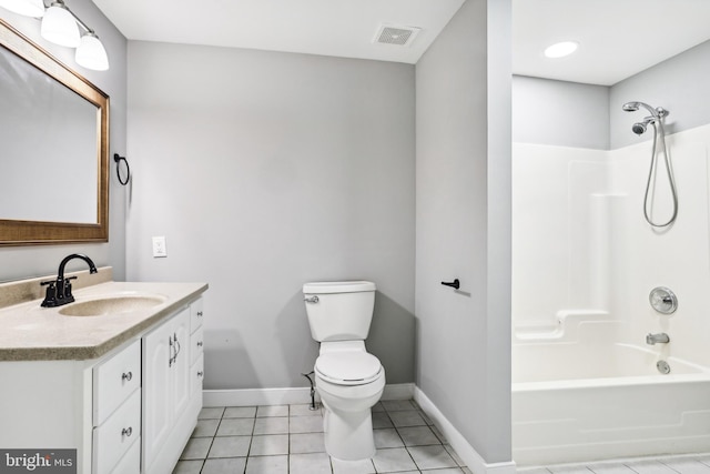 full bathroom with tile patterned floors, vanity,  shower combination, and toilet