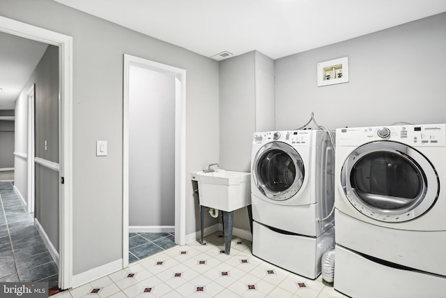 laundry room featuring separate washer and dryer