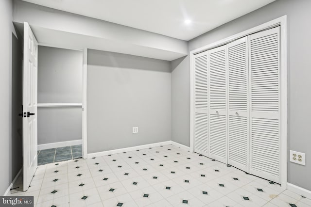 unfurnished bedroom with a closet