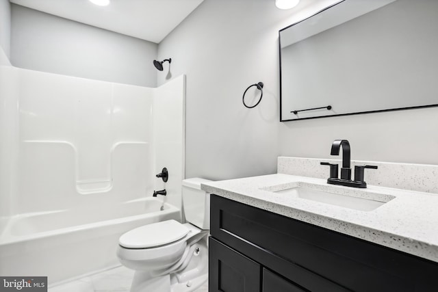 full bathroom featuring vanity, bathtub / shower combination, and toilet