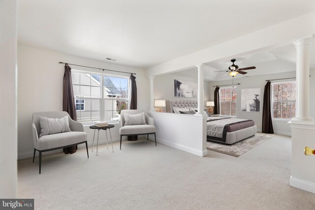 carpeted bedroom with multiple windows and ceiling fan