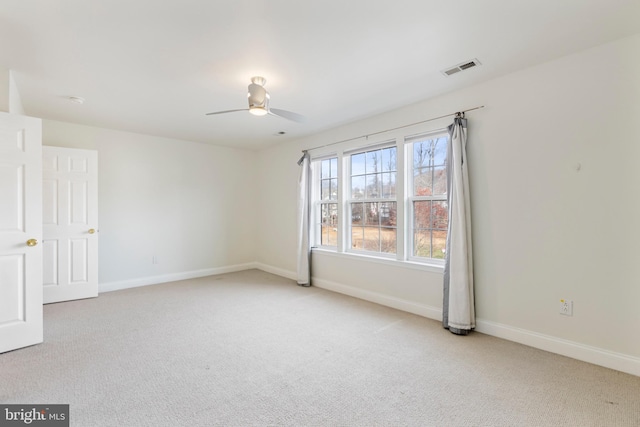 carpeted empty room with ceiling fan