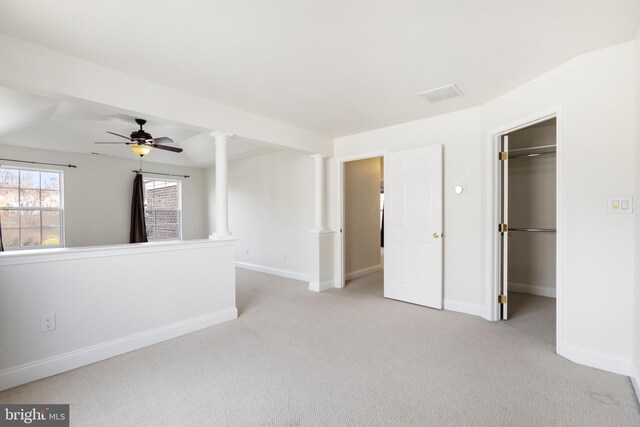 empty room with ceiling fan and light colored carpet