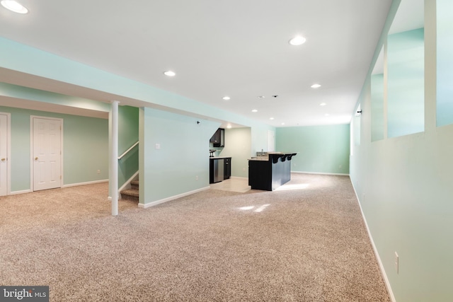 basement with light colored carpet