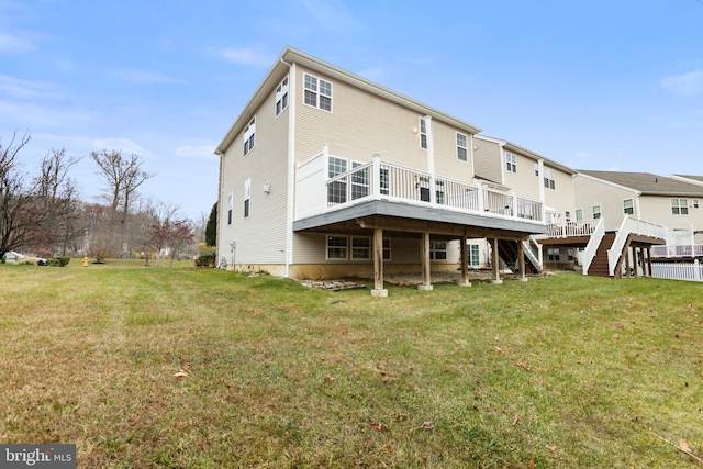 back of house with a yard and a wooden deck