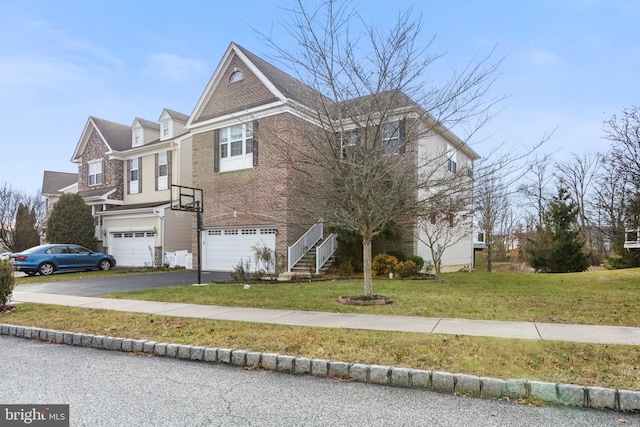 view of front of home featuring a garage and a front lawn