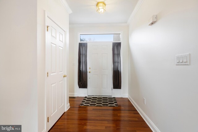 doorway with dark hardwood / wood-style floors and ornamental molding