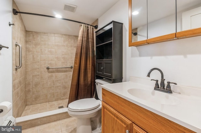 bathroom with tile patterned flooring, vanity, a shower with shower curtain, and toilet