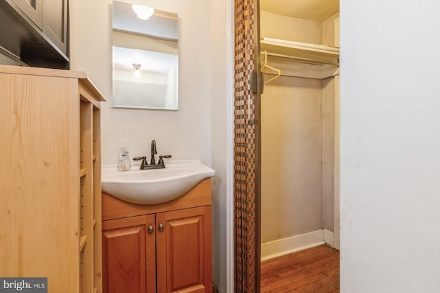 bathroom featuring wood-type flooring and vanity