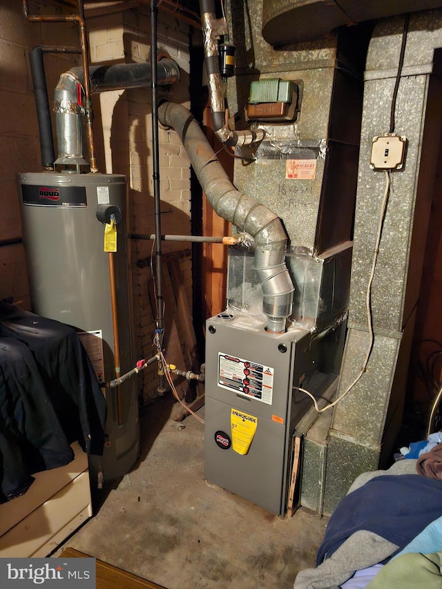 utility room with gas water heater