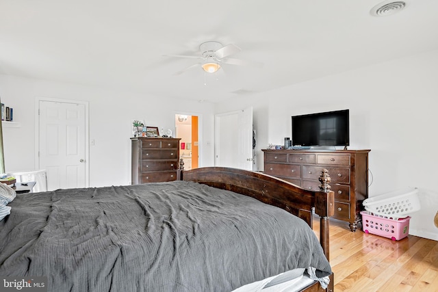 bedroom with light hardwood / wood-style flooring and ceiling fan