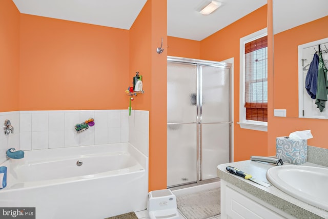 bathroom featuring vanity and plus walk in shower