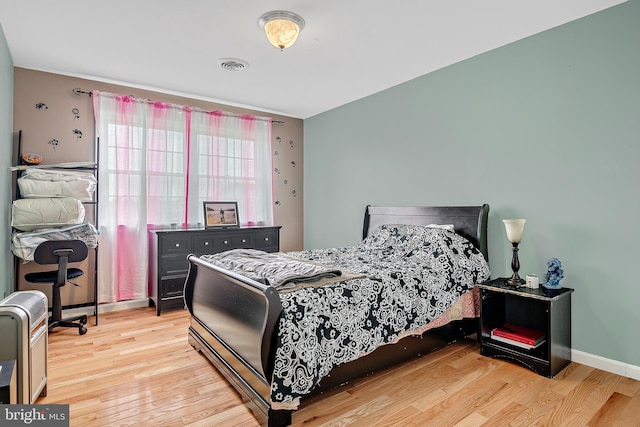 bedroom with light wood-type flooring