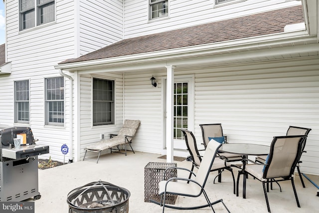 view of patio / terrace with an outdoor fire pit and grilling area