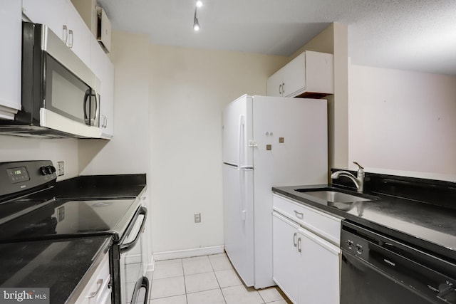 kitchen with light tile patterned flooring, sink, white cabinets, and black appliances