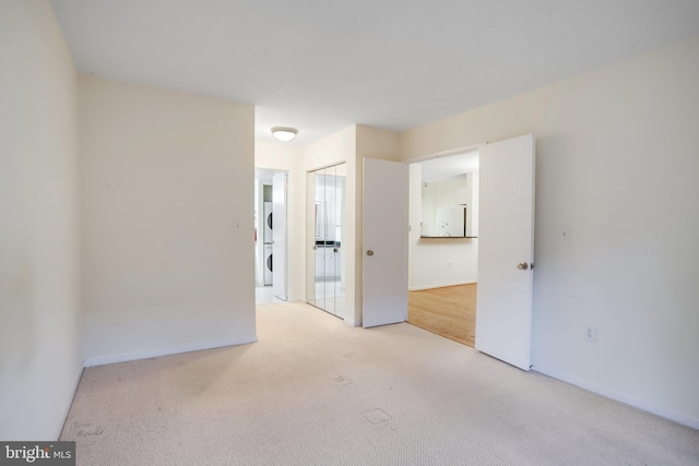 empty room with light colored carpet