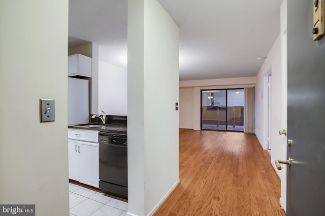 hall with light wood-type flooring and sink