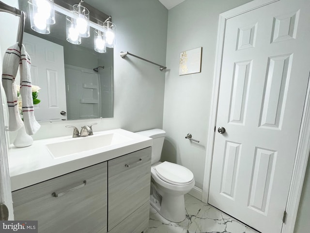 bathroom featuring vanity, toilet, and a shower