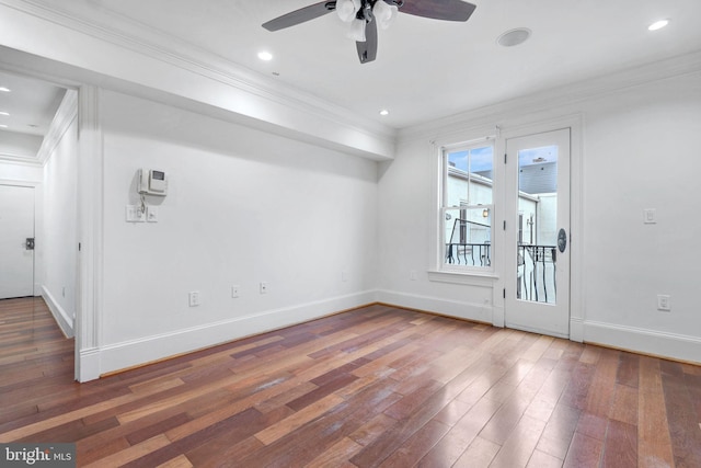 spare room with ceiling fan, crown molding, hardwood / wood-style flooring, baseboards, and recessed lighting
