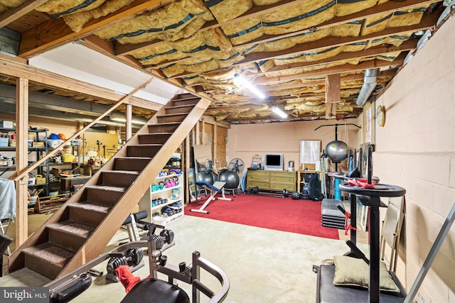 exercise room featuring concrete floors