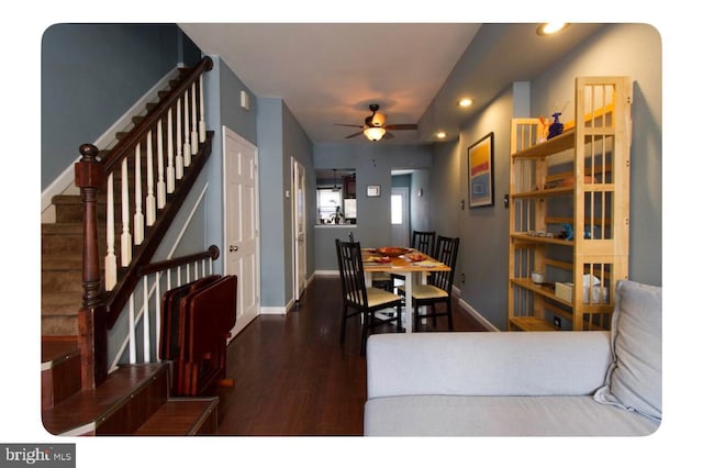 dining area with ceiling fan and dark wood-type flooring