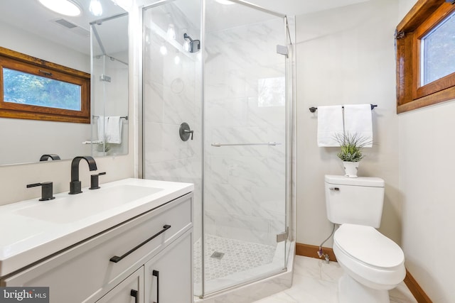 bathroom with toilet, walk in shower, and vanity