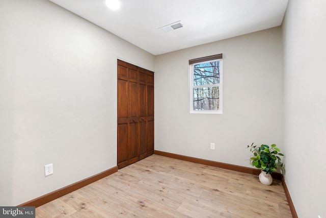 spare room with light wood-type flooring