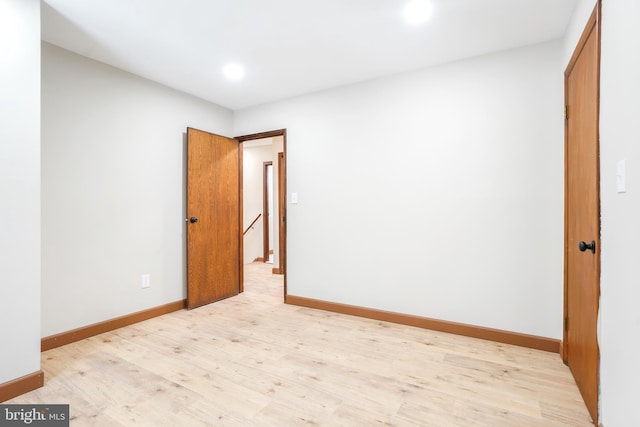 spare room featuring light hardwood / wood-style floors