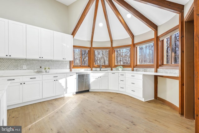 kitchen with sink, white cabinetry, light wood-type flooring, and dishwasher