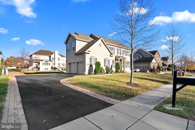 view of side of home featuring a lawn and a garage