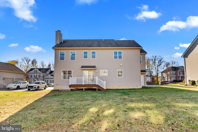 rear view of house with a lawn