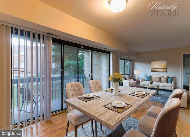 dining area with light wood-type flooring