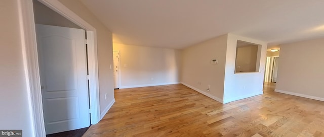 unfurnished room featuring light hardwood / wood-style floors