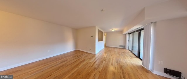 spare room with light wood-type flooring