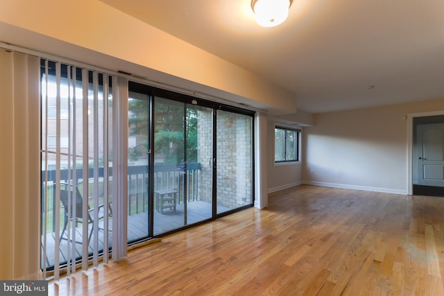 unfurnished room featuring hardwood / wood-style floors