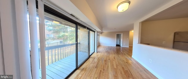 hall with light wood-type flooring