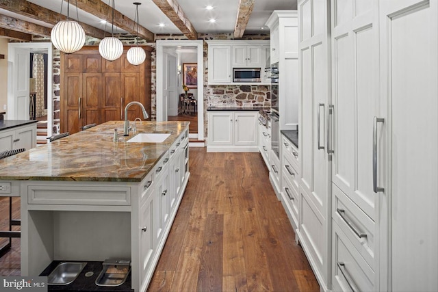 720 Swedesford Rd, Lower Gwynedd, PA 19002 - kitchen featuring a sink, stainless steel microwave, dark wood-style floors, beamed ceiling, and white cabinetry