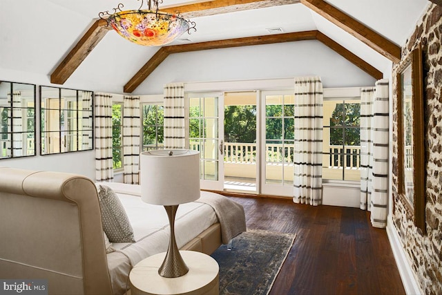 interior space featuring dark hardwood / wood-style floors and vaulted ceiling with beams